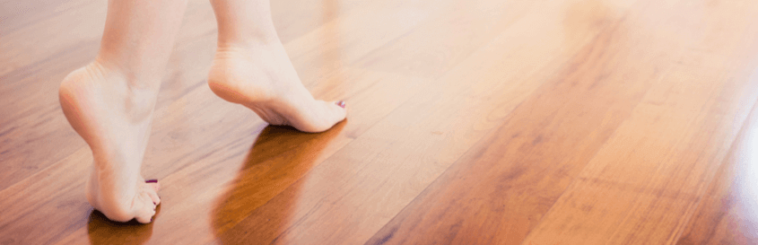 feet walking across a hardwood floor